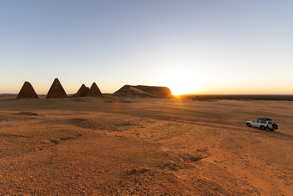 Field of Kushite royal pyramids and Mount Jebel Barkal at sunrise; Karima, Northern State, Sudan