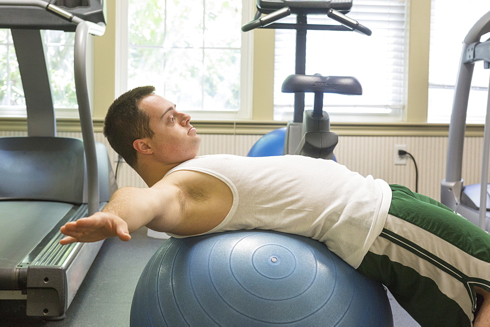 Man with Down Syndrome exercising in a gym