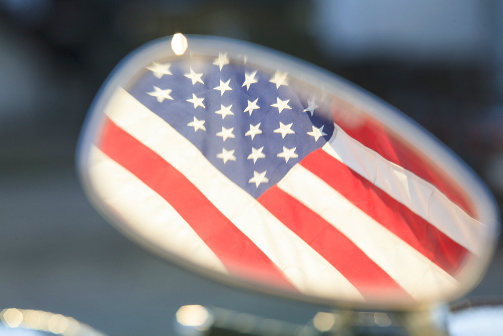 American flag reflected in motor scooter mirror