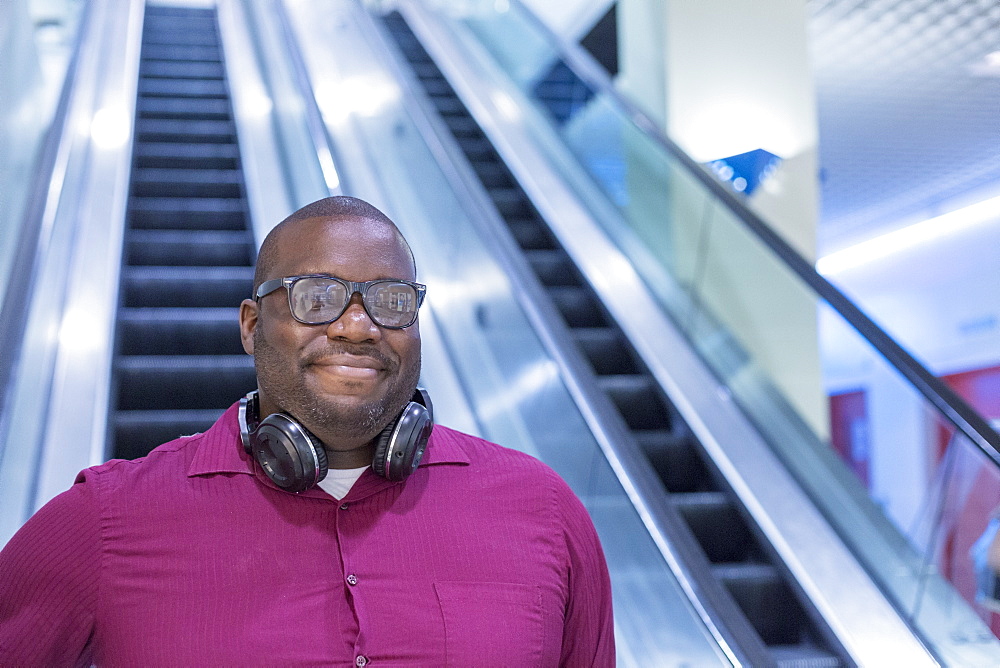 Man with ADHD on an escalator