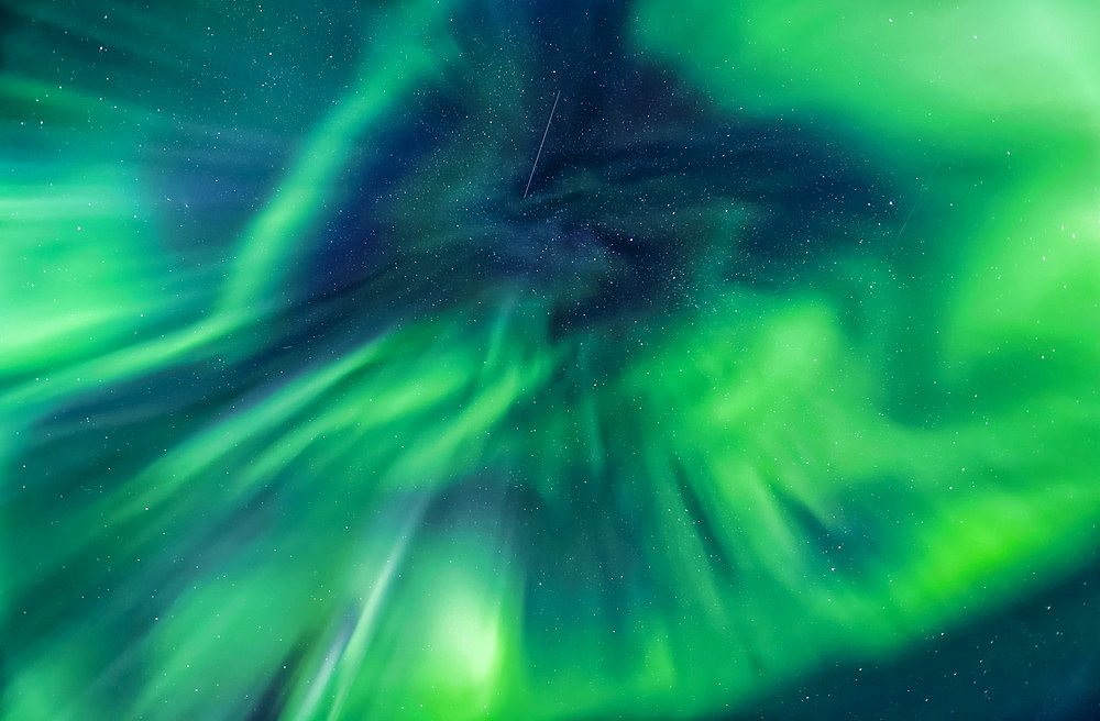 Corona aurora spreading in the sky, Taylor Highway, Interior Alaska in autumn; Alaska, United States of America