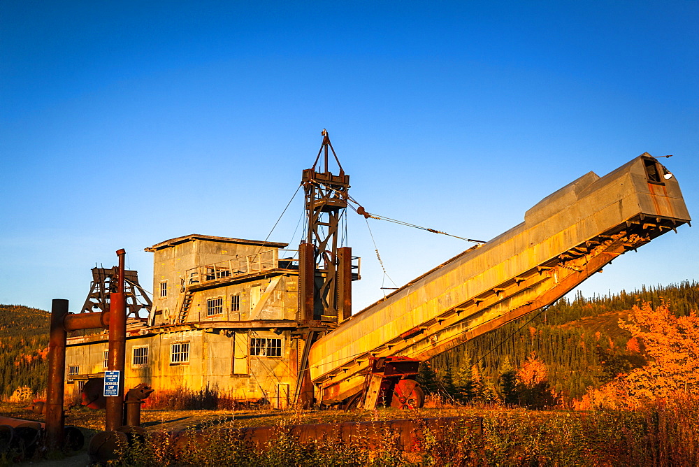 National Historical Site, the Pedro Dredge in warm sunset light, Interior Alaska in autumn; Chicken, Alaska, United States of America