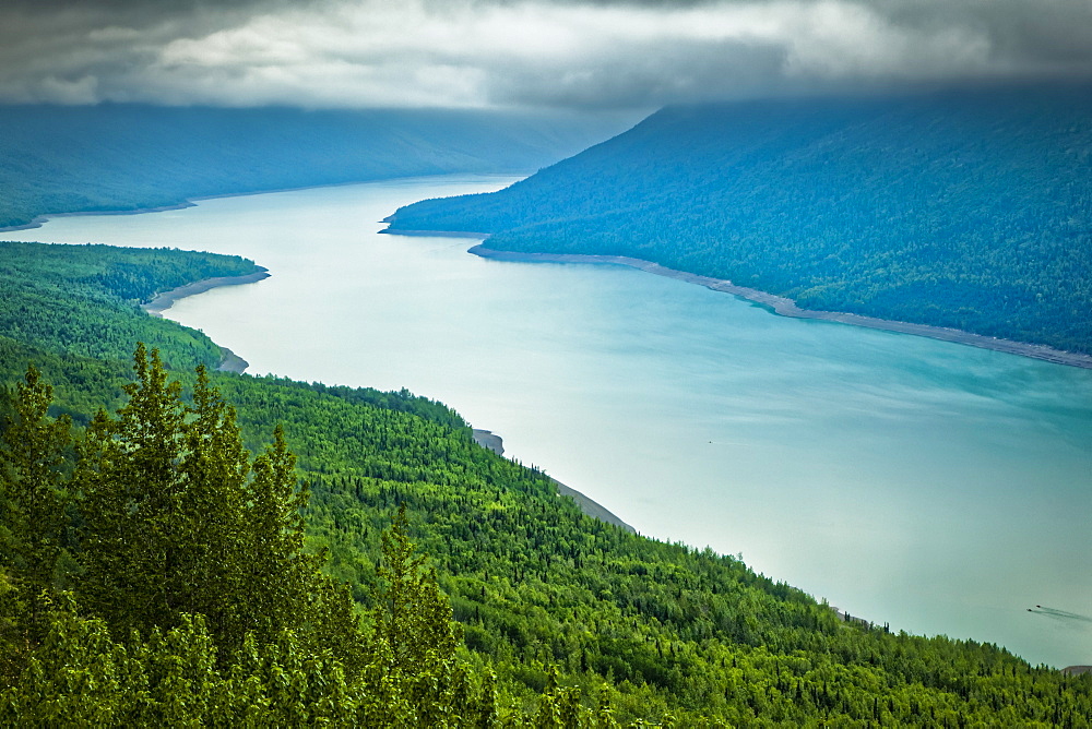 Aerial view of Eklutna Lake surrounded by greens, Chugach State Park, South-central Alaska in summertime; Alaska, United States of America