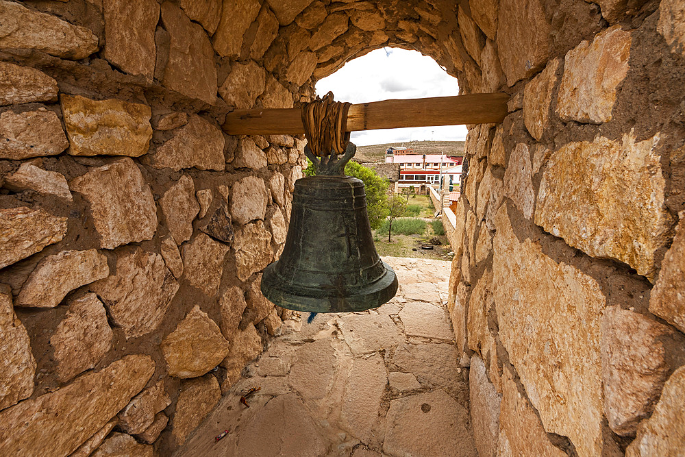 Bell at the entrance arch to the Church of San Cristobal de Lipez; San Cristobal, Potosi, Bolivia