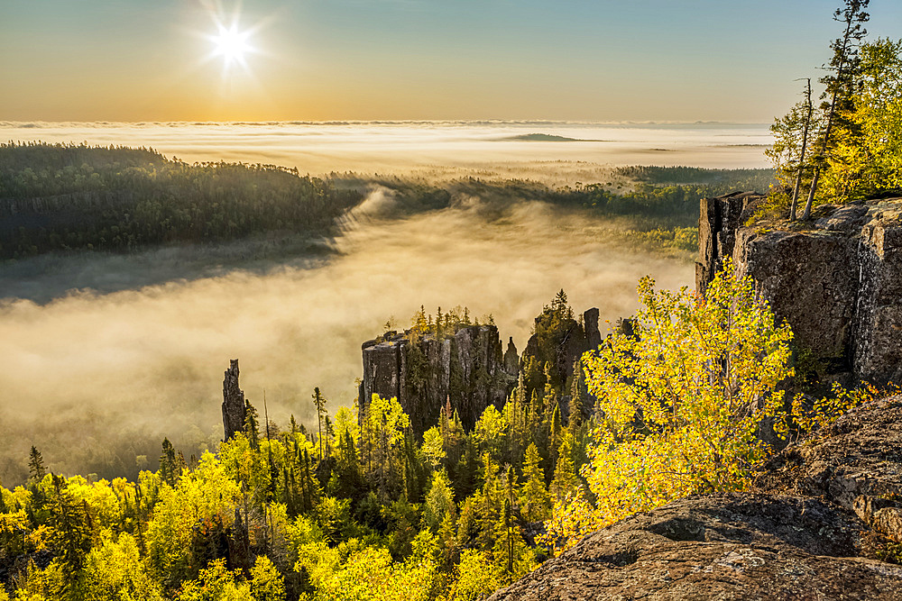 Sunrise over a misty, foggy valley in the Canadian Shield; Dorian, Ontario, Canada