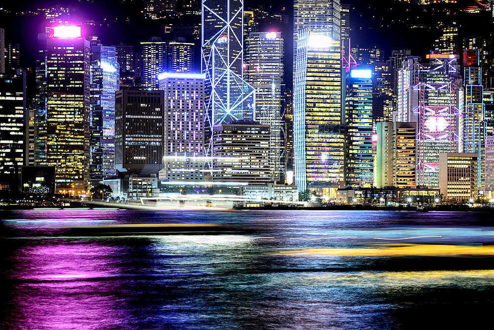 Night view of Hong Kong and moving light trails of boats; Hong Kong, Hong Kong Special Administrative Region (SAR), Hong Kong