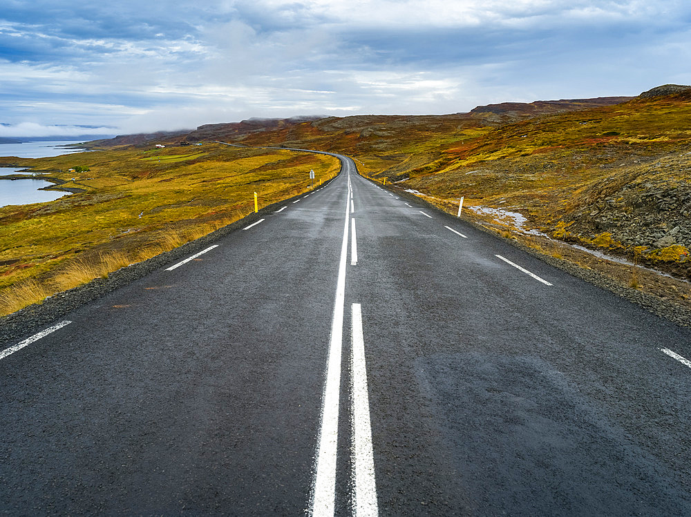 Paved road running along the coastline of Northwestern Iceland; Hunaping vestra, Northwestern Region, Iceland