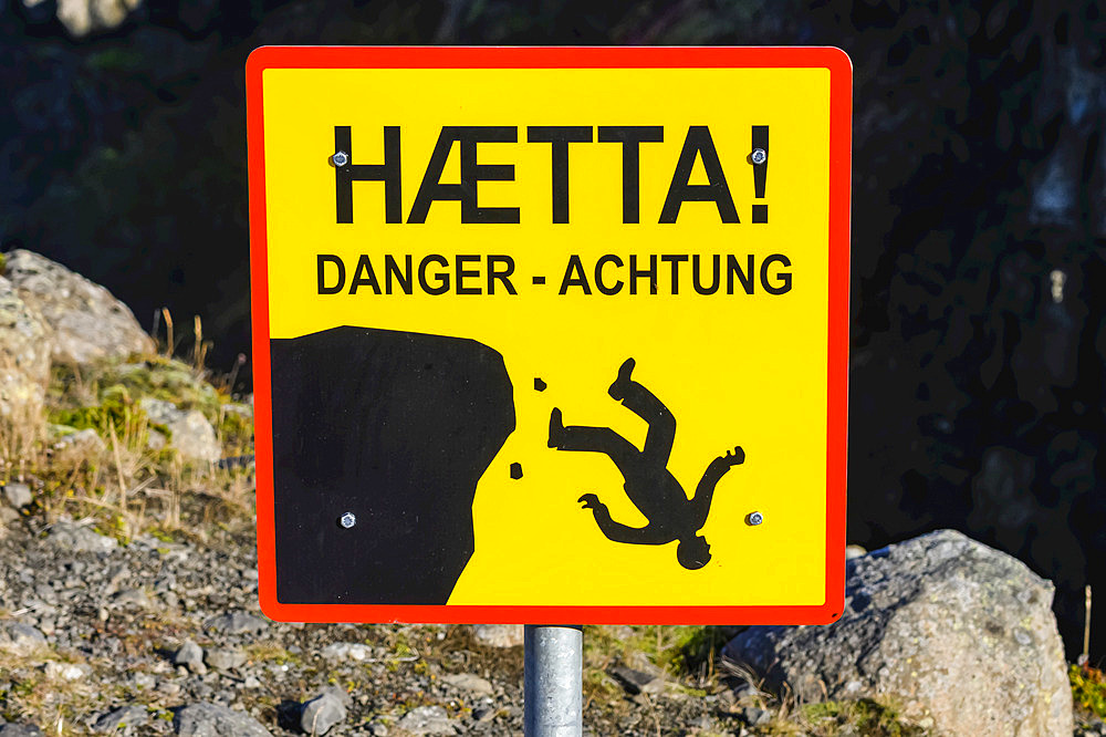 Caution sign at Kolugljufur Gorge, a canyon with a spectacular waterfall in Northwest Iceland; Hunaping vestra, Northwestern Region, Iceland