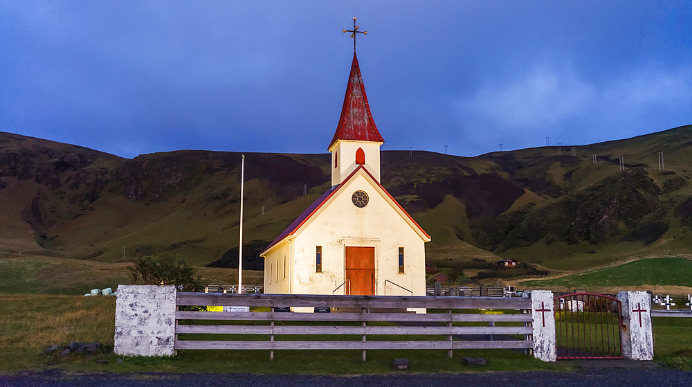 A church with tower in a remote seaside village in South Iceland; Iceland