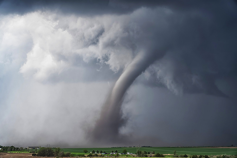 Amazing clouds over the landscape of the American mid-west as supercell thunderstorms develop. Huge tornado on the ground; Woodward, Nebraska, United States of America