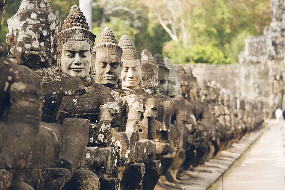 Statues at South gate to Bayon temple, Angkor Wat complex; Siem Reap, Cambodia