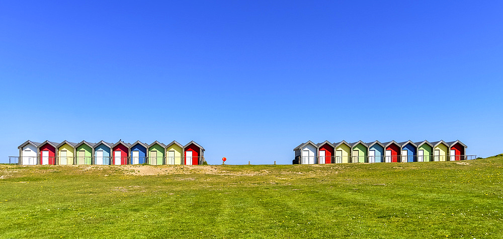 Colourful painted structures used for change rooms at the beach on the coast; Blyth, Northumberland, England