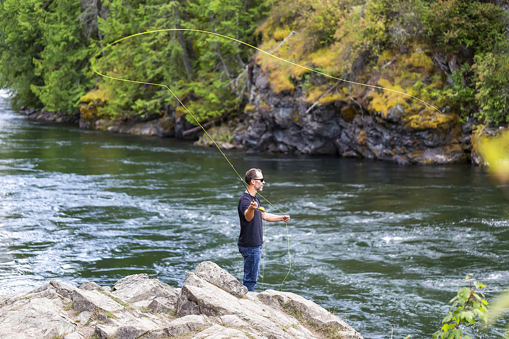 A man fly fishing on Adams River, near Salmon Arm; British Columbia, Canada