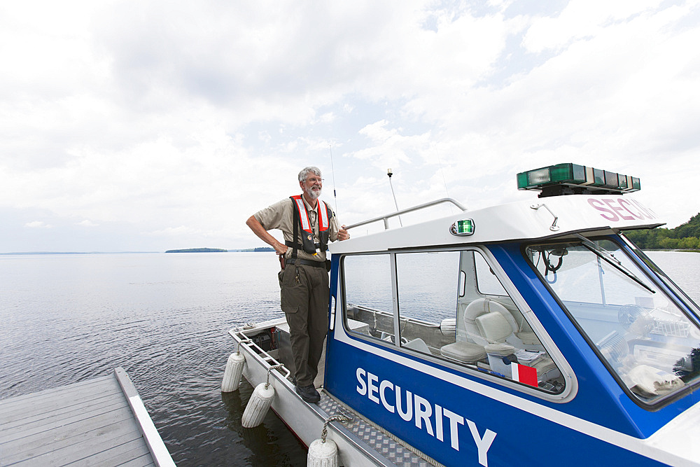 Security boat patrolling public water supply