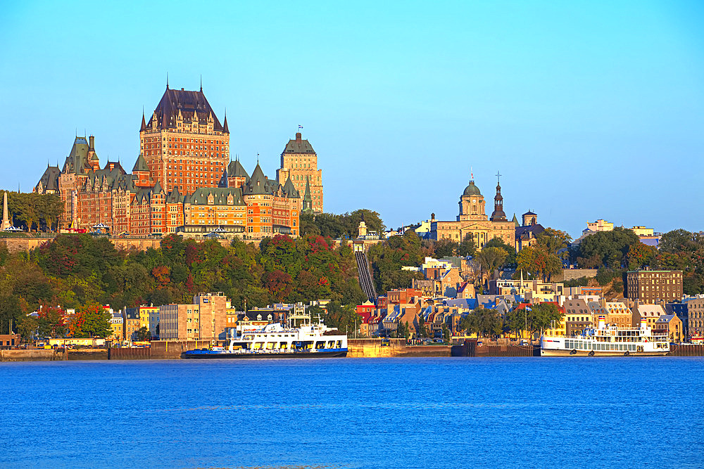 Chateau Frontenac and a vehicle ferry on the Saint Lawrence River; Quebec City, Quebec, Canada