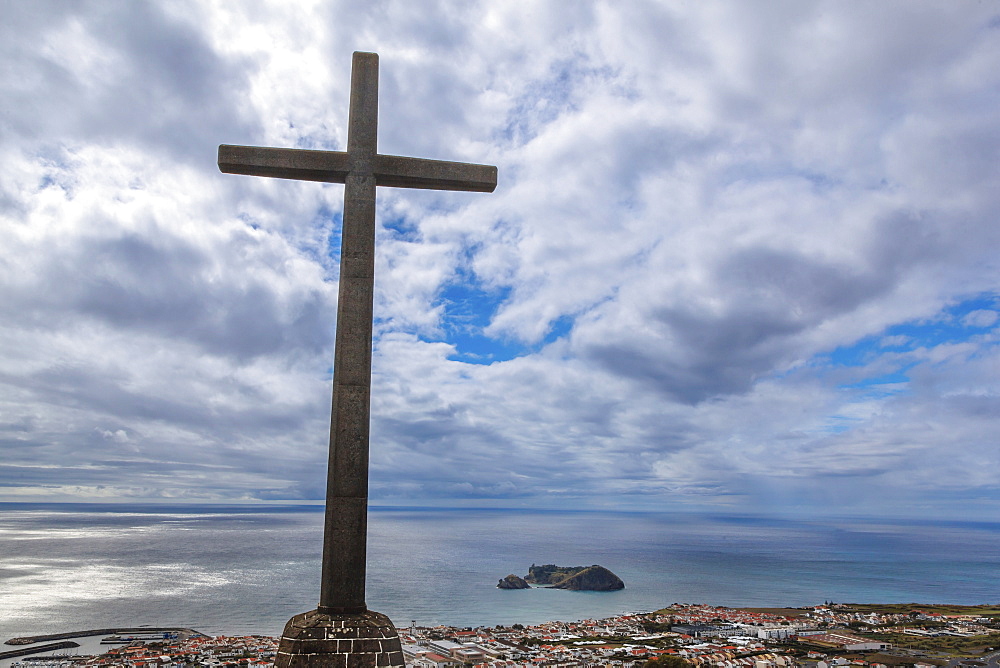 A large cross on a hilltop looking over a city on Sao Miguel Island at Our Lady of Peace Church; Sao Miguel Island, Azores, Portugal