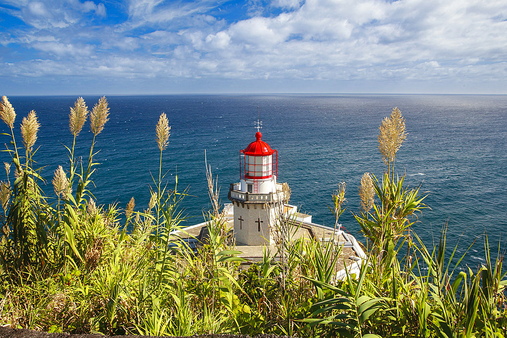 The Farol do Arnel Lighthouse at Ponta do Arnel near Nordeste overlooking the Atlantic Ocean; Sao Miguel Island, Azores