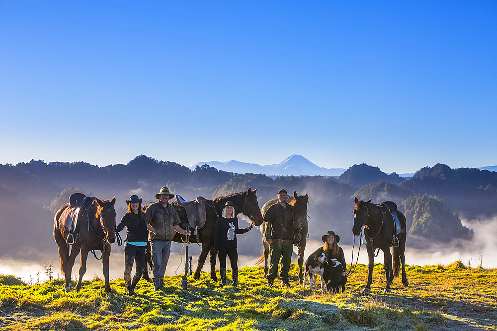 The Blue Duck lodge located in the Whanganui National Park is a working cattle farm with a focus on conservation. Travelers take horses to a scenic viewpoint to watch the sunrise over the rainforest; Retaruke, Manawatu-Wanganui, New Zealand