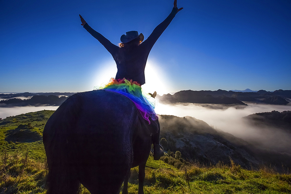 The Blue Duck lodge located in the Whanganui National Park is a working cattle farm with a focus on conservation. Travellers go to a scenic viewpoint to watch the sunrise over the rainforest; Retaruke, Manawatu-Wanganui, New Zealand