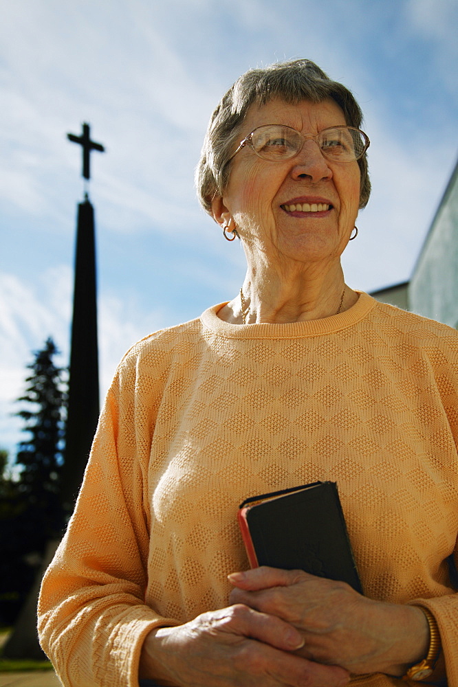 Woman Holding Bible In Hand