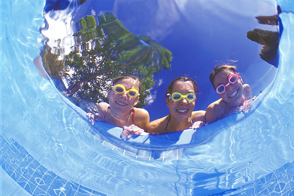 Friends Peering Into A Pool