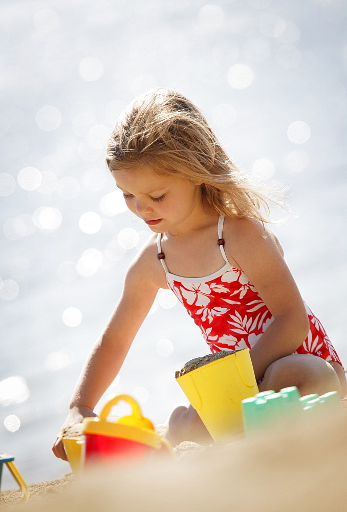 Child Playing In The Sand