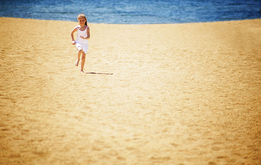 Girl Runs On The Beach