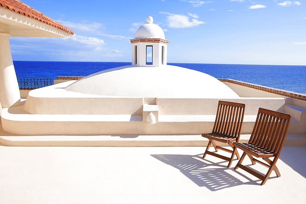 Two Chairs Waiting In A Tropical Paradise