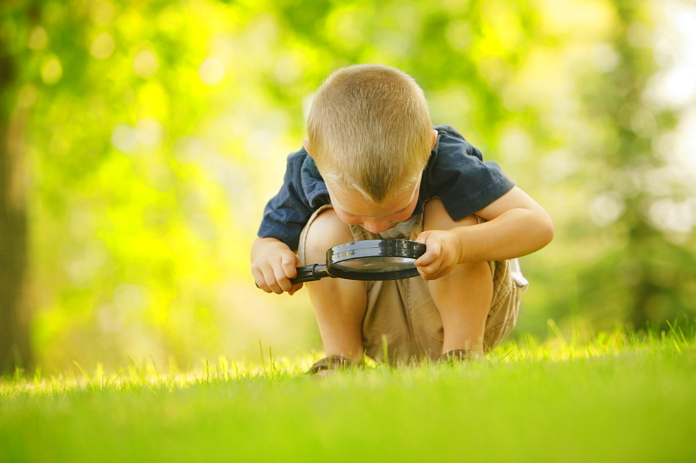 Boy With Magnifying Glass