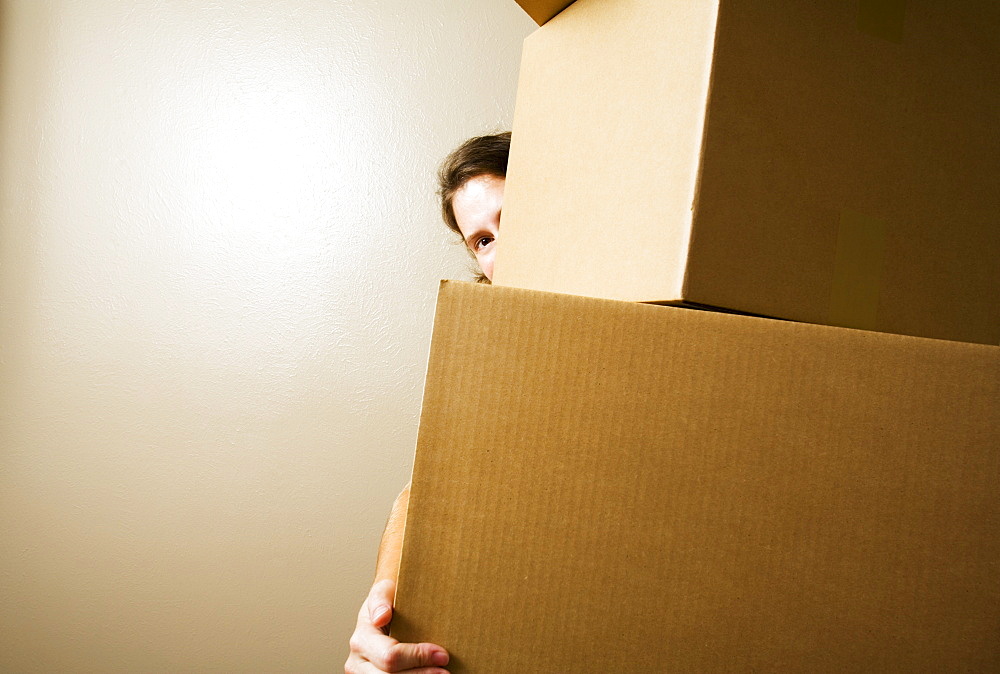 Woman Carrying Heavy Boxes