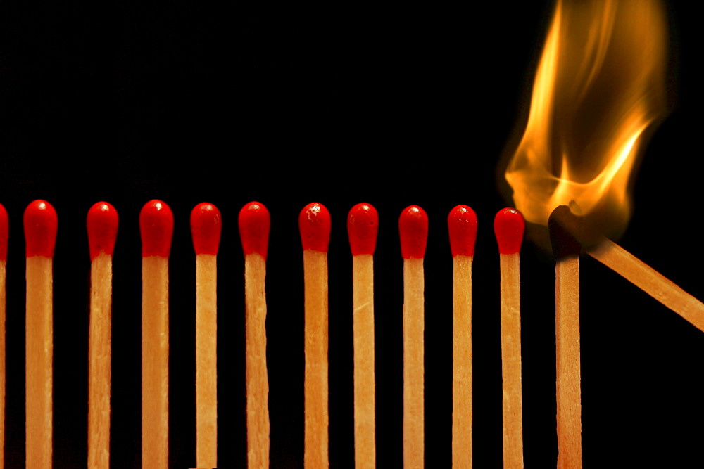 Closeup View Of Burning Match Sticks