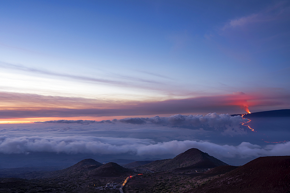 Spectacular view from above the clouds of the 2022 eruption and lava flow of Mauna Loa Volcano (Moku‘āweoweo, the world's largest active volcano) on the Big Island of Hawaii, Island of Hawaii, Hawaii, United States of America