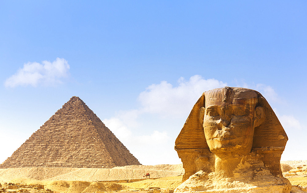 View of the Great Pyramid and Sphinx of Giza under a blue sky, Giza, Cairo, Egypt