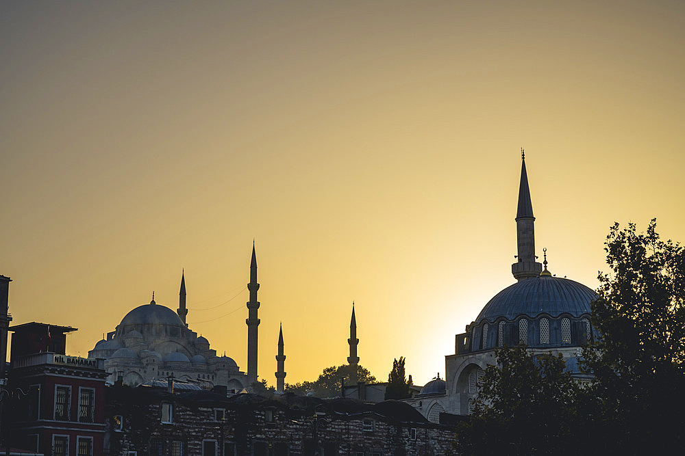 Silhouettes of mosque's minarets and domes at sunset, Istanbul, Turkey