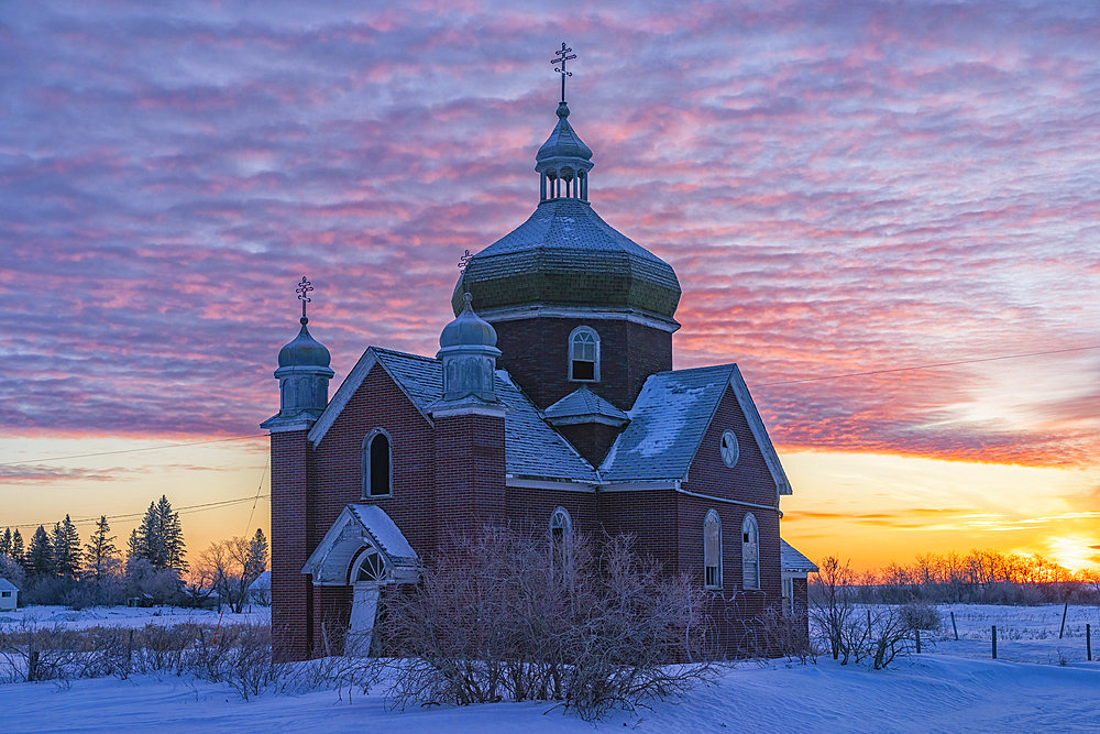 Abandoned Ukrainian church at sunrise in winter, Insinger, Saskatchewan, Canada