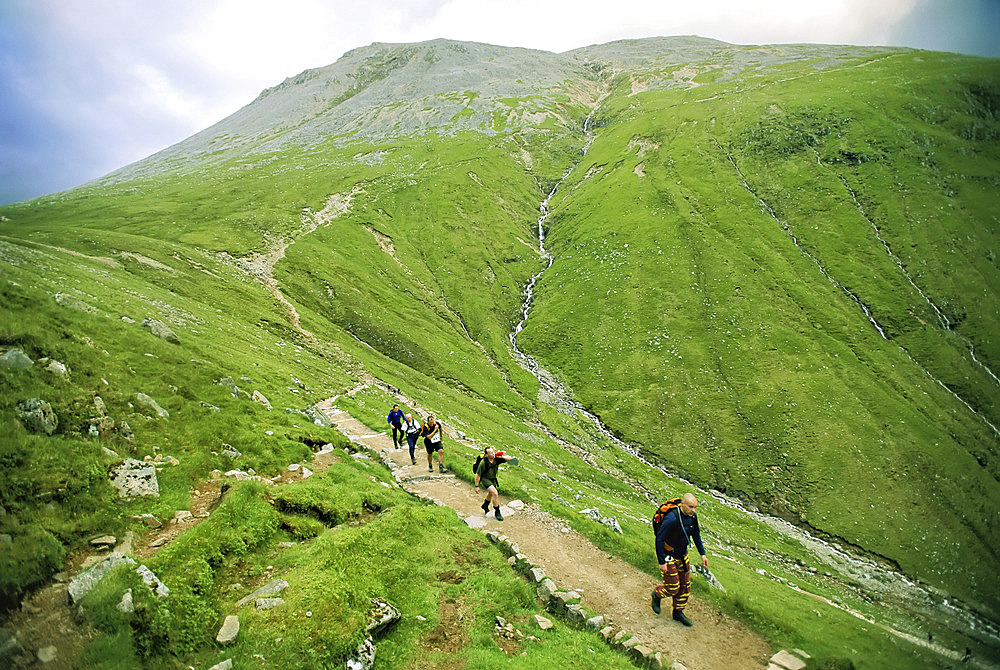 Team of hikers climb Scotland's Ben Nevis peak, Ben Nevis, Scotland