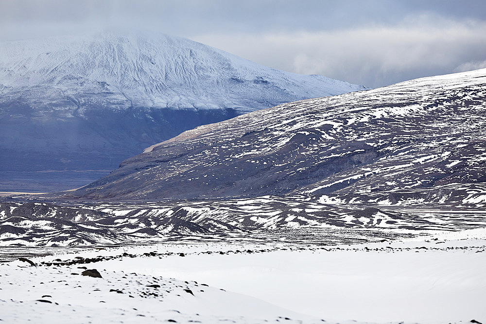 Snow-clad mountains in early winter in the Kaldidalur Valley, seen from Langjokull Glacier, in the western Highlands of west Iceland, Iceland