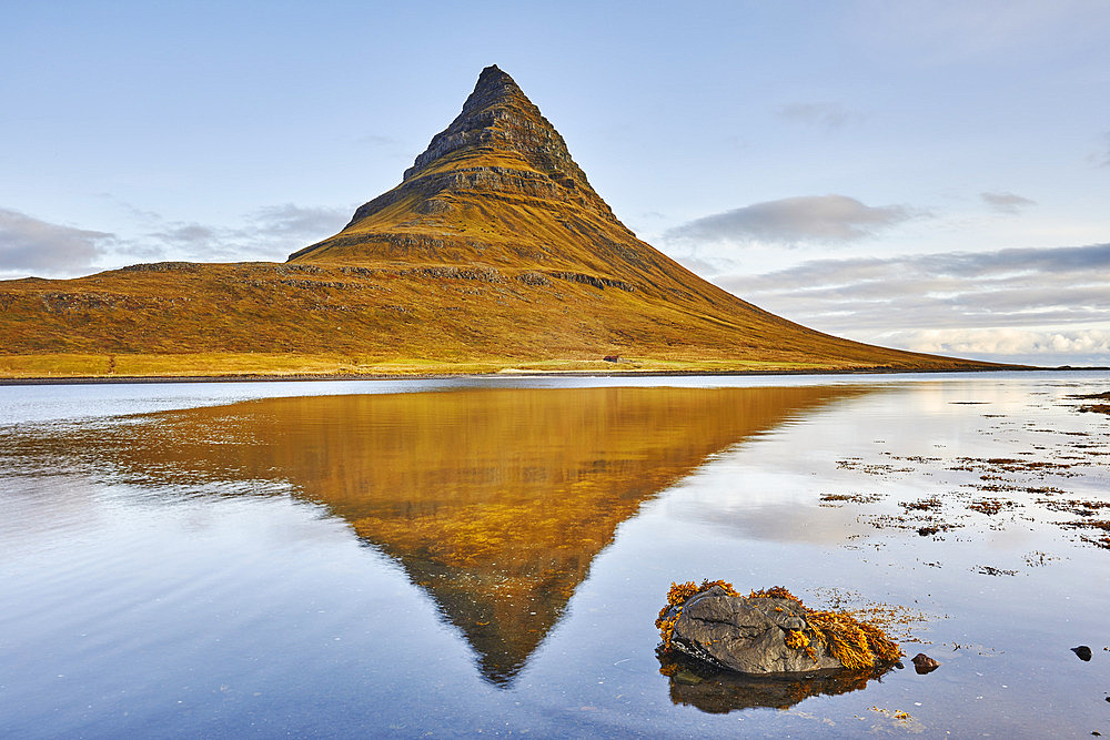 Kirkjufell mountain and it's mirror image in water, near Grundarfjordur, Snaefellsnes, Iceland, Iceland