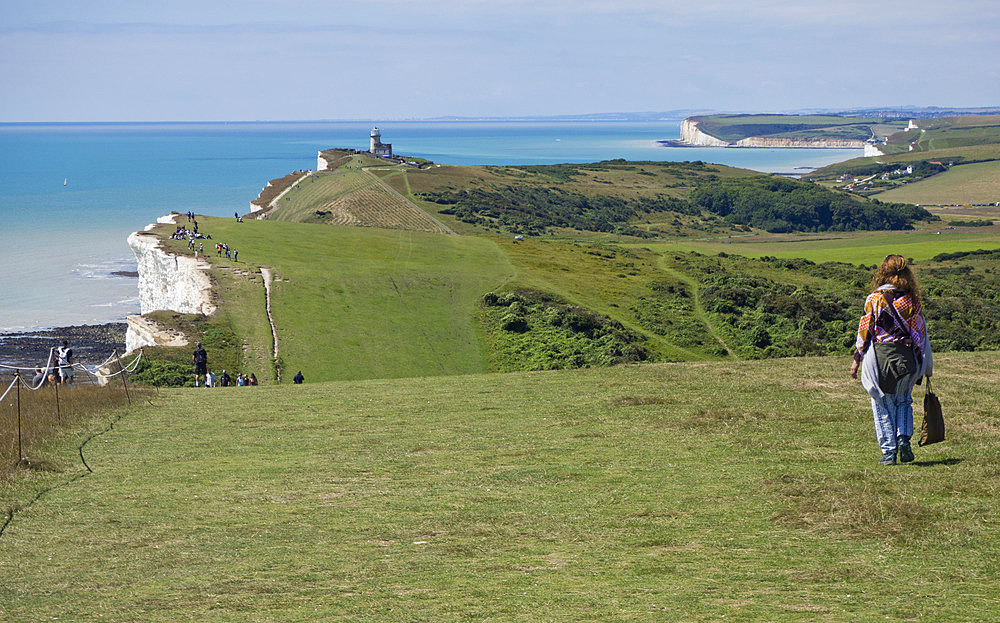 Beachy Head coast path with Belle Tout Lighthouse and the Seven Sisters Cliff in the background, Beachy Head, East Sussex, UK, East Sussex, England