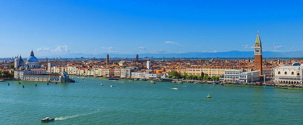 Stunning vista of the City of Venice with St Mark's Campanile and Chiesa Santa Maria della Salute at Punta della Dogana, viewed from the bell tower of San Giorgio Maggiore Island, Venice, Veneto, Italy