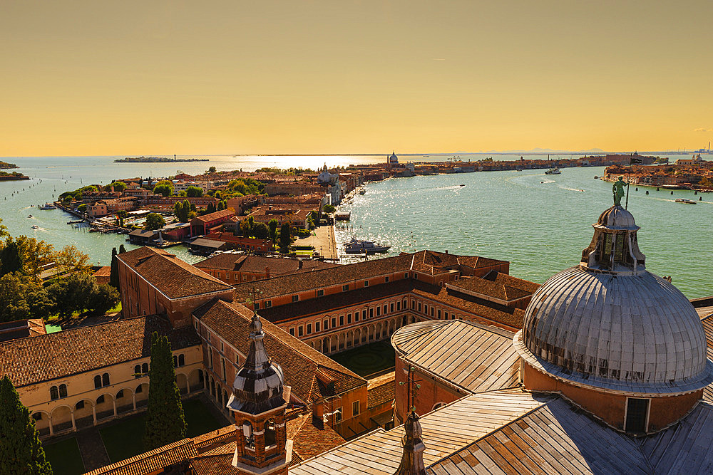 View of a Venetian canal and Giudecca island at sunset from the bell tower of the church of San Giorgio Maggiore, Venice, Italy