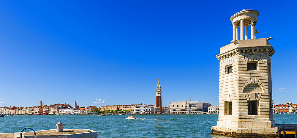 Lighthouse on the island of San Giorgio Maggiore with a view of Piazza San Marco, the Campanile and the Doge's Palace, Venice, Veneto, Italy