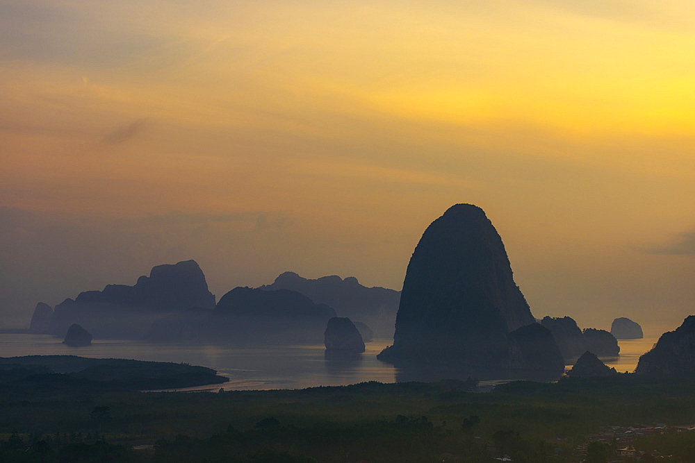 Silhouetted karst rock formations at sunset in Phang-Nga, Thailand, Ao Phang Nga, Phang-nga, Thailand