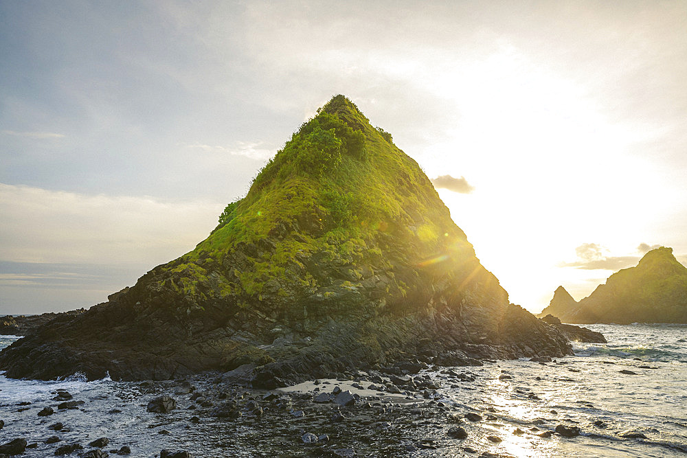 Peaked landforms and sunset light along a rugged Indonesian island at Telawas Beach, Mekar Sari, Praya Barat, Central Lombok Regency, West Nusa Tenggara, Indonesia