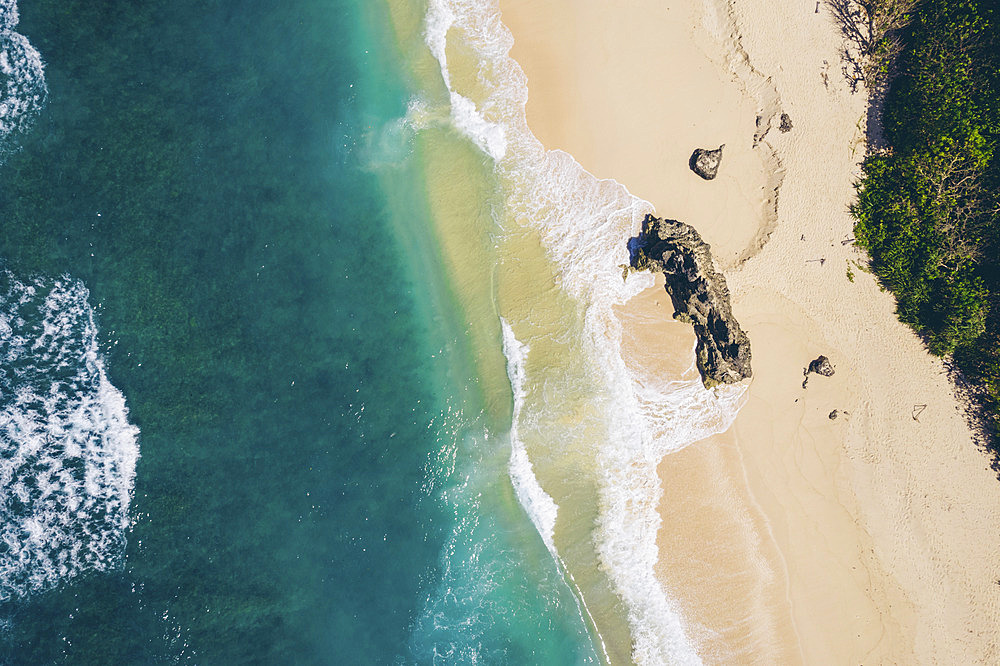 Aerial view of directly above Mbawana Beach with white sand and turquoise ocean, East Nusa Tenggara, Indonesia, Kodi Bangedo, Southwest Sumba Regency, East Nusa Tenggara, Indonesia