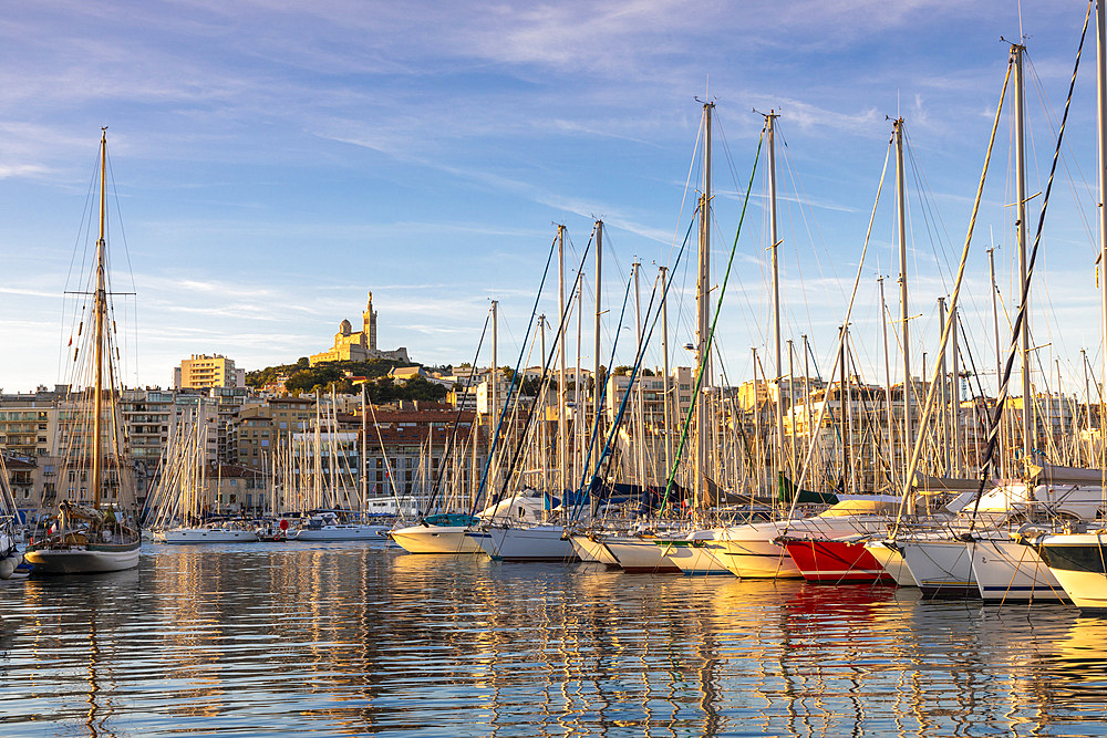 Marseille Harbour and Notre-Dame de la Garde at sunrise, Marseille, Bouches-du-Rhone, Provence-Alpes-Cote d'Azur, France, Western Europe