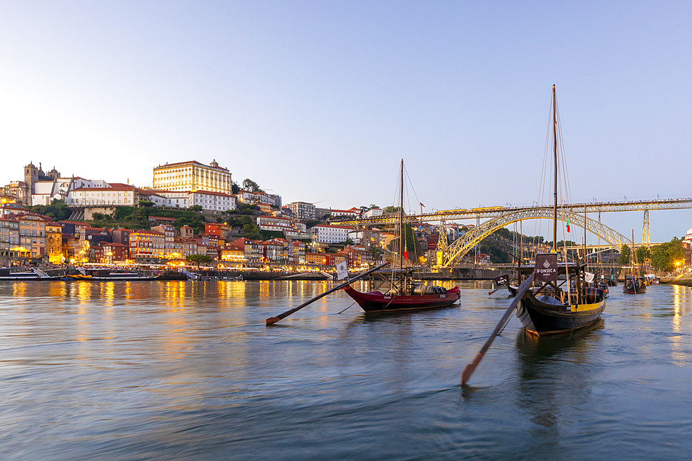 Rabelo Boats on the River Douro with the Dom Luis l Bridge at dusk, UNESCO World Heritage Site, Porto, Norte, Portugal, Europe