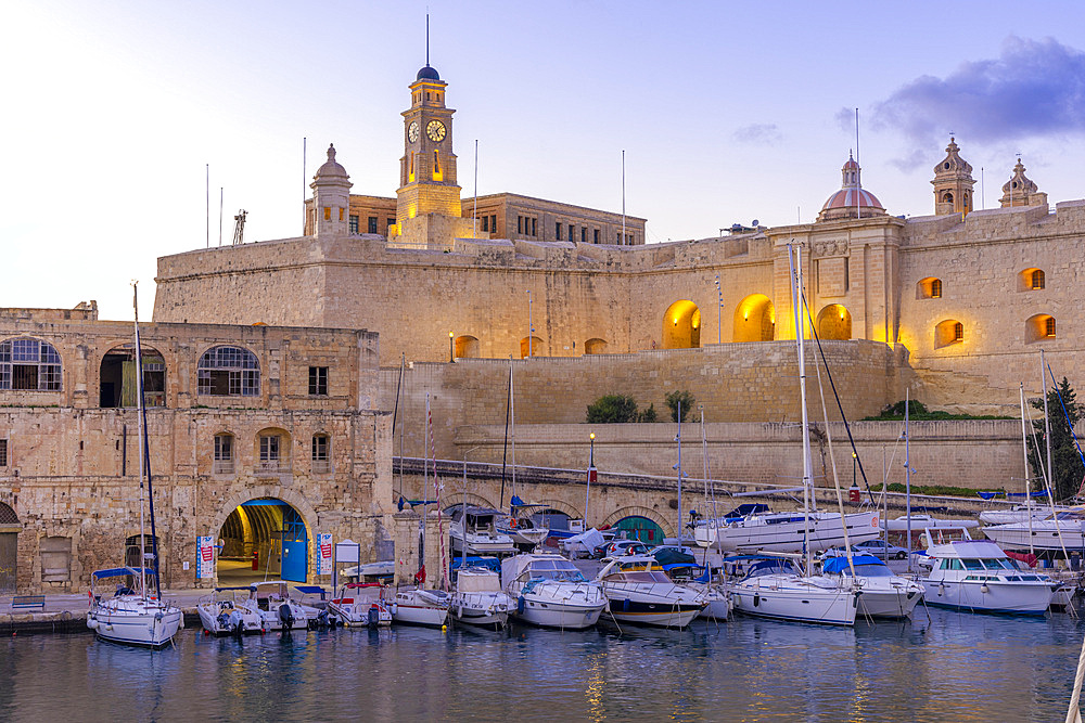 The Old Dock Buildings at Bormla Waterfront with the Fort St. Michael Clock Tower in the Background at Dusk, Cospicua, Malta, Southern Europe