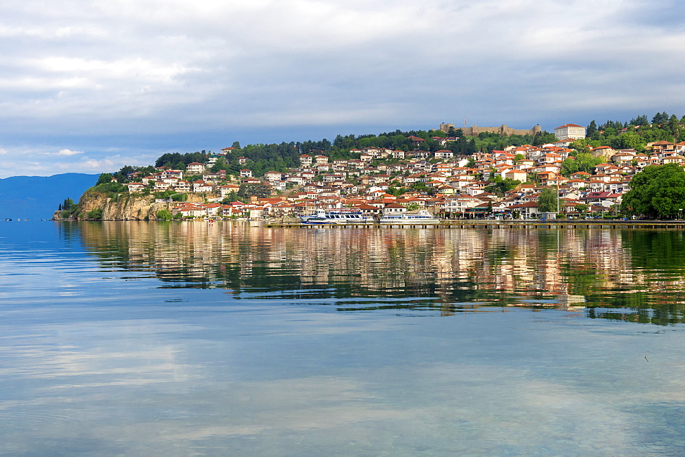 Ohrid old city reflected in Lake Ohrid, UNESCO World Heritage Site, Macedonia, Europe