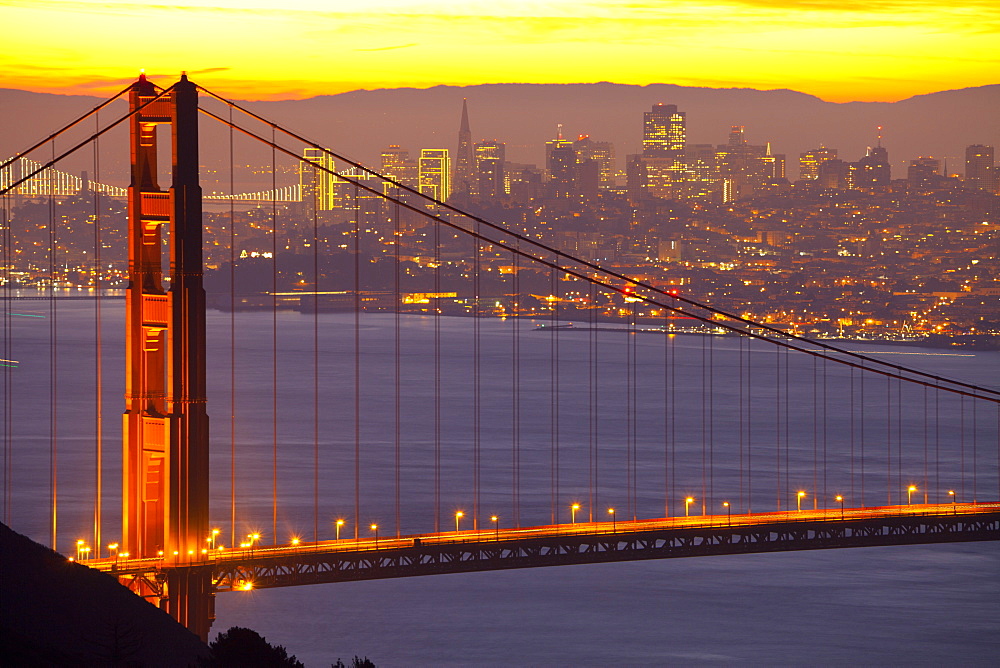 The Golden Gate Bridge and San Francisco skyline at sunrise, San Francisco, California, United States of America, North America